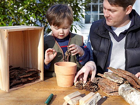 INSECT_HOUSE_BUILDING_PROJECT_WITH_FATHER_AND_SON__PLACING_CONES_IN_POT__STEP_8