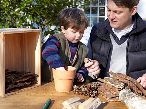 INSECT_HOUSE_BUILDING_PROJECT_WITH_FATHER_AND_SON__PLACING_CONES_IN_POT__STEP_7