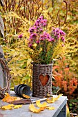 AUTUMN ARRANGEMENT WITH ASTERS AND ASPARAGUS OFFICINALIS