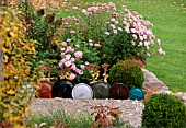 DECORATIVE EDGING USING LIDS FROM COOKING POTS