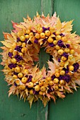 AUTUMN ARRANGEMENT WITH LEAVES AND BERRIES