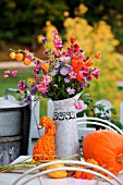 AUTUMN ARRANGEMENT IN DECORATIVE METAL JUG