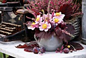 AUTUMN ARRANGEMENT WITH ANEMONE  CALLUNA AND CORYLUS AVELLANA PURPUREA AND PLUMS