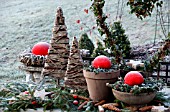 A TABLE IN THE GARDEN DECORATED FOR CHRISTMAS