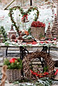 A TABLE IN THE GARDEN DECORATED FOR CHRISTMAS