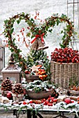 A TABLE IN THE GARDEN DECORATED FOR CHRISTMAS