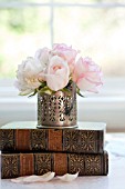 ROSA ESPERANCE IN ANTIQUE SILVER VASE WITH ANTIQUE BOOKS