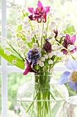 CONVALLARIA MAJALIS, AND AGUILEGIA IN GLASS VASE