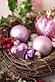 ILEX IN BIRD NEST WITH HEART SHAPED GLASS ORNAMENTS