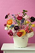 RANUNCULUS, MUSCARI ARMENIACUM, NARCISSUS AND HYACINTHOIDES HISPANICA IN FLORAL ARRANGEMENT