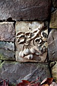 STONE WALL WITH DECORATIVE RELIEF INSET OF FRUIT