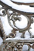 WEATHERED CAST IRON ORNATE GARDEN CHAIRS IN SNOW