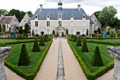 BUXUS SEMPERVIRENS AND TOPIARY IN FORMAL PARTERRE GARDEN WITH STONE URNS AT CHATEAU DE BRECY