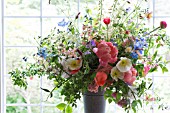 PAEONIA LACTIFLORA CORAL CHARM, WITH POPPIES AND MIXED SPRING FLOWERS