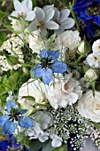 DELPHINIUM PAGAN PURPLES, DELPHINIUM BLUE JAY, PHLOX PANICULATA DAVID, WHITE ROSES, NIGELLA DAMASCENA AND CARNATION