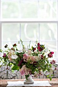 TULIPA, RANUNCULUS, ANEMONE CORONARIA AND LUCOJUM IN SPRING ARRANGEMENT