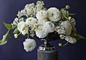 WHITE RANUNCULUS ASIATICUS AND SYRINGA VULGARIS ANGEL IN ANTIQUE SILVER PEDESTAL BOWL