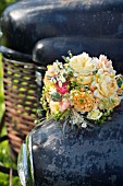 ROSA GRAHAM THOMAS AND ROSA PORT SUNLIGHT IN BOUQUET OF DAVID AUSTIN ENGLISH ROSES WITH HERBS AND SEED HEADS ON OLD TRUCK