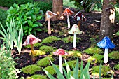 BLOWN GLASS MUSHROOM SCULPTURES IN MOSS GARDEN, BY ARTIST BARBARA SANDERSON