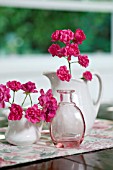 ROSA THE LOVELY FAIRY IN WHITE PITCHERS WITH PINK GLASS BOTTLE