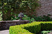 BRICK PATIO OF FORMAL GARDEN WITH BUXUS HEDGE
