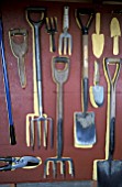 GARDEN TOOLS ON SHED WALL