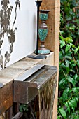 THE DRAWING ROOM GARDEN  URBAN LONDON GARDEN  WATER FEATURE CLOSE UP WITH STAINLESS STEEL SPOUT.  DESIGNED BY: EARTH DESIGNS.