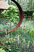 RHS CHELSEA FLOWER SHOW 2013, M&G CENTENARY GARDEN WINDOWS THROUGH TIME DESIGNER ROGER PLATTS.