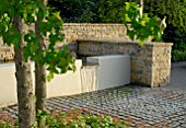 LIQUIDAMBER STYRACIFLUA WITH CONTEMPORARY WATER FEATURE AND GRANITE SETTS