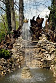 NEPTUNE AND THE DANCING CROWN FOUNTAIN IN THE STUMPERY POOL AT HANHAM COURT