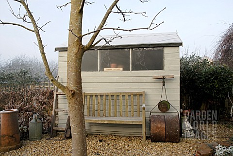 WINTER_SHED_WITH_SEAT_AND_OLD_LAWN_ROLLER