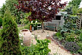 MIXED BORDERS,  POT AND SHED IN RURAL GARDEN