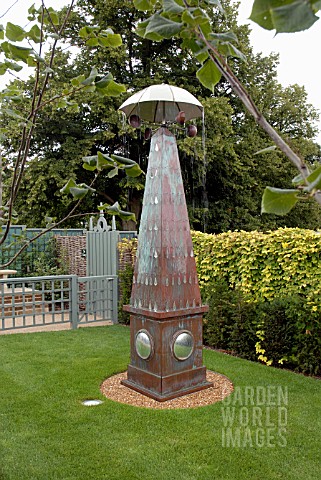 OBELISK_WITH_BROLLY_AT_THE_GARDEN_OF_SURPRISES_BURGHLEY_HOUSE_STAMFORD_DESIGNER_GEORGE_CARTER