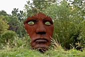 VERTICAL FACE BY RICK KIRBY IN THE SCULPTURE GARDEN AT BURGHLEY HOUSE, STAMFORD.