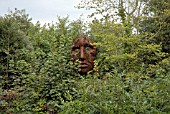 STEEL FACE BY RICK KIRBY IN THE SCULPTURE GARDEN AT BURGHLEY HOUSE, STAMFORD.