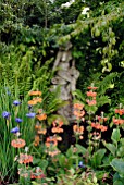 POND WITH STATUE AND PRIMULA BULLEYANA AND IRIS SIBIRICA CAESARS BROTHER