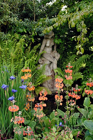 POND_WITH_STATUE_AND_PRIMULA_BULLEYANA_AND_IRIS_SIBIRICA_CAESARS_BROTHER