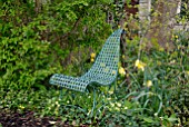 RUSTIC METAL CHAIR IN SPRING GARDEN