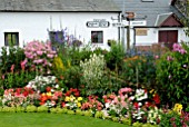 COLOURFUL BORDER IN GARDEN IN BROUGHTON,NEAR BIGGAR, SCOTLAND