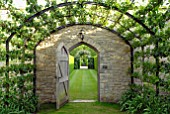 PEAR TUNNEL AND DOORWAY AT OZLEWORTH PARK, GLOUCESTERSHIRE
