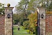 VIEW THROUGH GATES TO ROSE GARDEN AT OZLEWORTH PARK, GLOUCESTERSHIRE