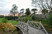 WOODEN BRIDGE AT OZLEWORTH PARK, GLOUCESTERSHIRE