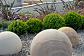 STONE AND BOX BALLS IN SHOW GARDEN AT MALVERN SPRING SHOW 2009, DESIGN BY JULIET STAFFORD