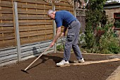 RAKING SOIL TO FINE TILTH PRIOR TO PLANTING