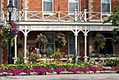 THE PRINCE OF WALES HOTEL WITH HANGING BASKETS AND PLANTERS,  NIAGARA ON THE LAKE,  ONTARIO,  CANADA