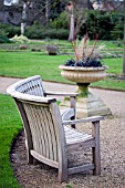 SEMI CIRCULAR BENCH AND WINTER PLANTED URN AT OXFORD BOTANICAL GARDENS