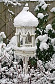 SNOW COVERED GOTHIC BIRD FEEDING STATION