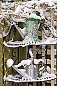 DECORATIVE WATERING CANS COVERED IN SNOW