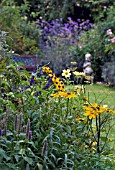 COTTAGE GARDEN WITH STATUE AND BENCH