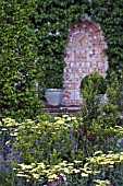 DETAIL OF PLANTING AND CLOCK IN THE FORTNUM AND MASON GARDEN,  CHELSEA FLOWER SHOW 2007,  DESIGNER ROBERT MYERS ASSOCIATES